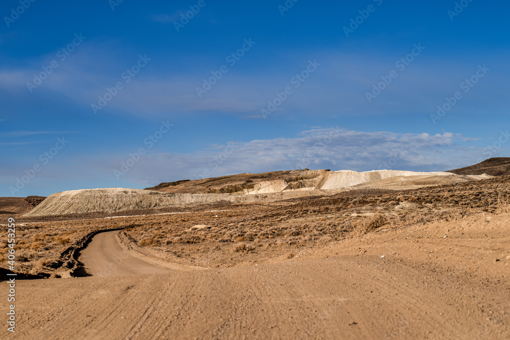 Road leading to Large mining tailings in the Northern Nevada desert