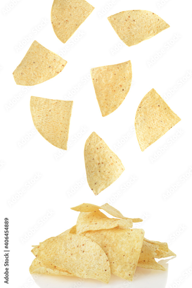 nacho chips falling onto a pile nacho chips falling onto a pile