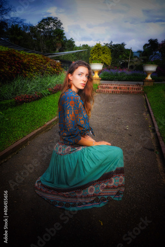 Sri Lanka woman in a dress in the botanical garden 