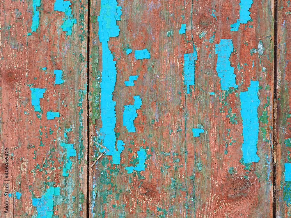old wooden door with peeling blue paint