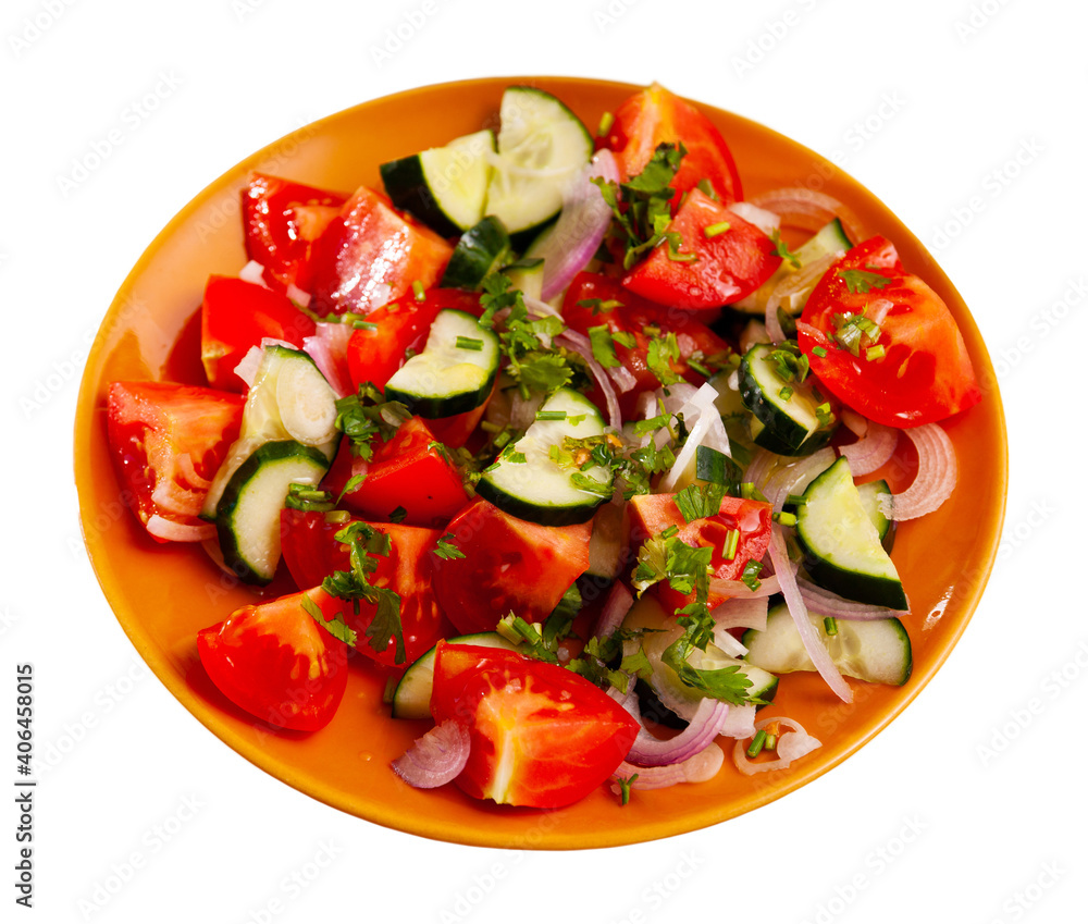 Appetizing summer cucumber and tomato salad closeup. Isolated over white background