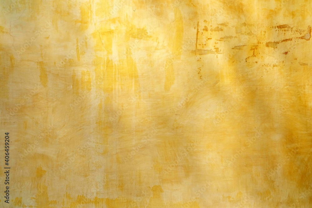 Yellow Grunge Vintage Wall Background with Light Beam.