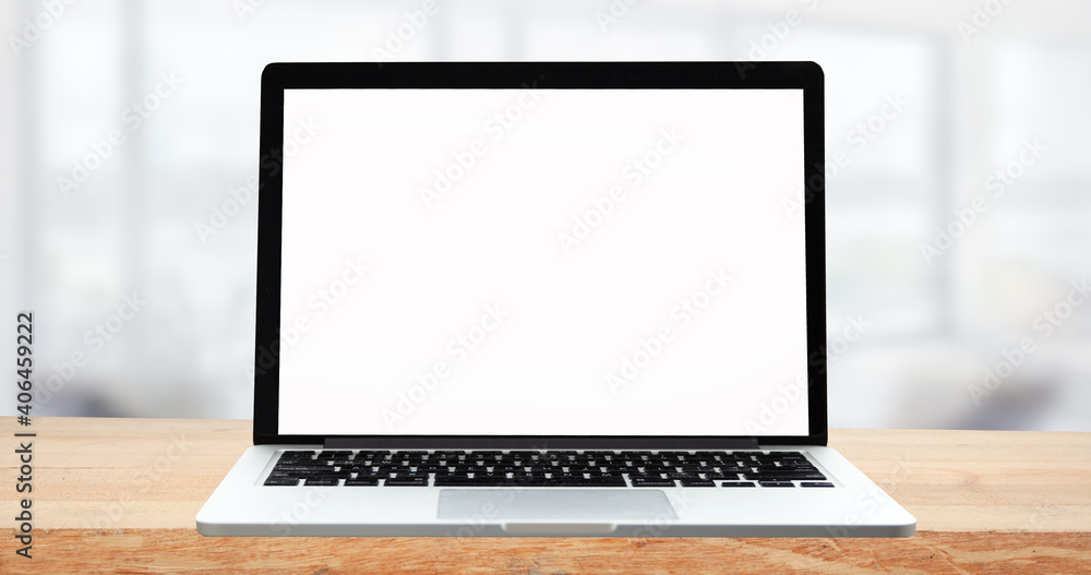 Laptop with blank screen on white table with office window view. Home interior or office background Laptop with blank screen on white table with office window view. Home interior or office background