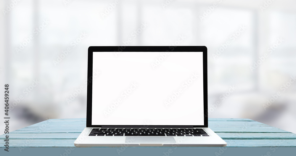 Laptop with blank screen on white table with office window view. Home interior or office background Laptop with blank screen on white table with office window view. Home interior or office background