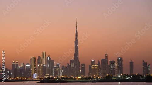 Dubai City Burj Khalifa Famous Landmark Skyline with Orange Sunset Sky photo