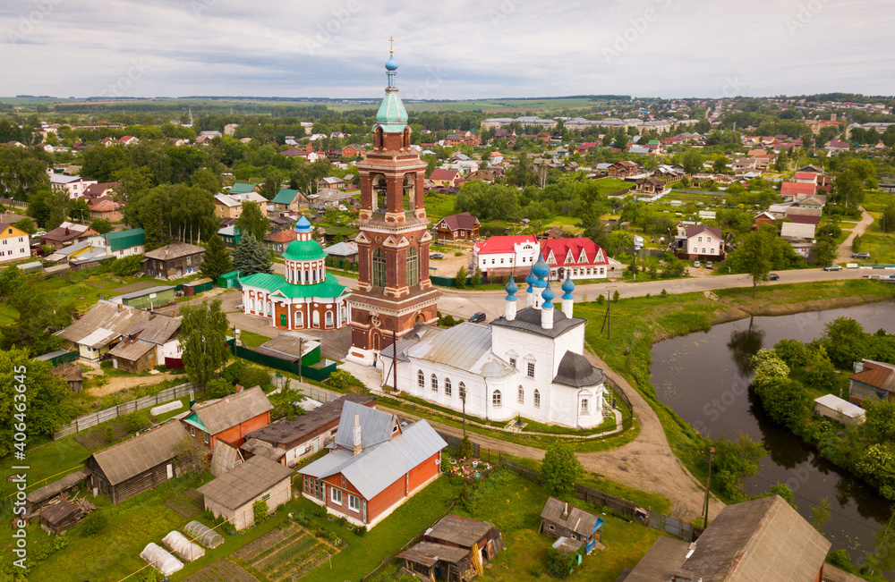 Picturesque scape of Russian town of Yuryev-Polsky on Koloksha River with Church of Intercession of Holy Virgin and Church of St. Nikita Martyr