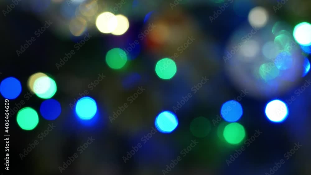 The multicolored Christmas lights of the garland on the tree sparkle brightly. Christmas tree decoration Christmas decor close-up 4K video glow. The multicolored Christmas lights of the garland on the tree sparkle brightly. Christmas tree decoration Christmas decor close-up 4K video glow.