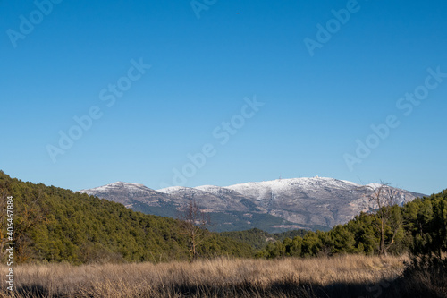 Mount Aitana with snow  on a sunny winter day.