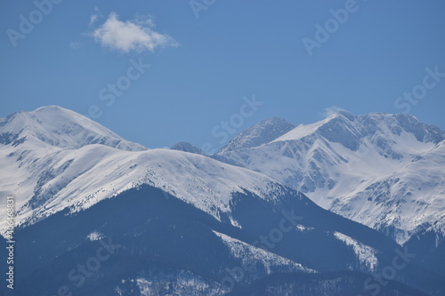 Snow covered mountains and blue sky