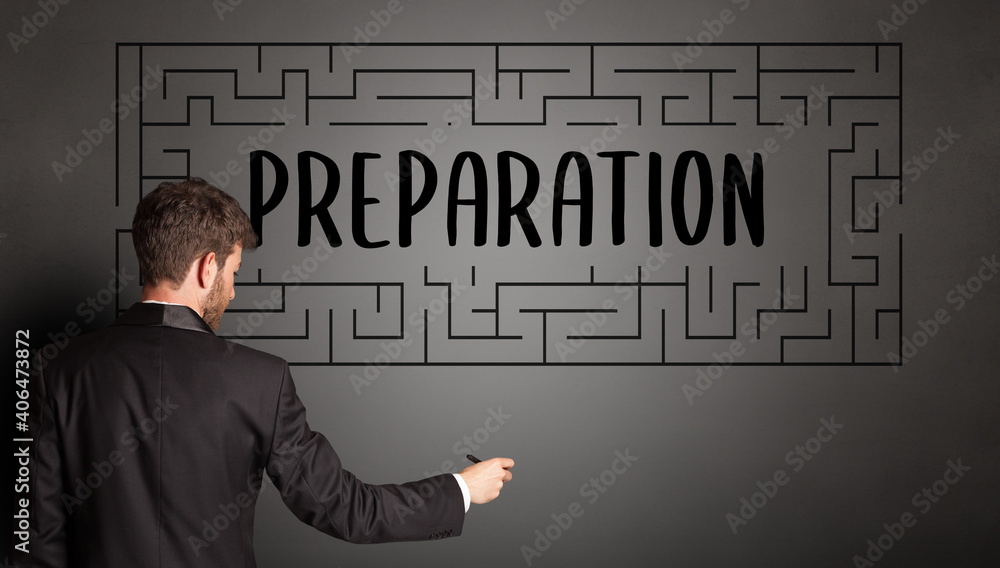 businessman drawing maze with PREPARATION inscription, business education concept businessman drawing maze with PREPARATION inscription, business education concept