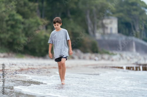 Boy on the beach. Family vacation by the sea. Active lifestyle