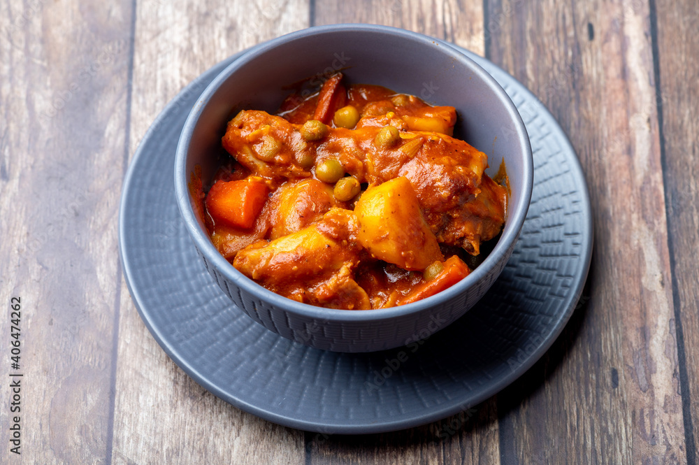 Chicken Afritada  (Spanish-style Chicken Stew) (Solo Full)  is a well-known Filipino dish that is cooked in tomato sauce with carrots, potatoes, green peas and bell peppers as the main vegetables.