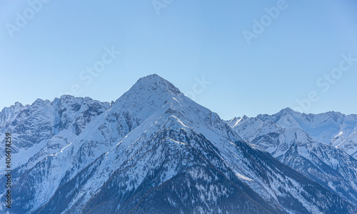 Mountain peaks textured and covered in melting snow - mountin ridges covered in snow