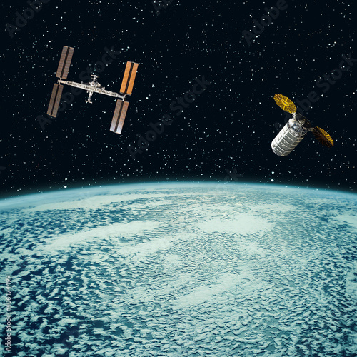 Satellites above the earth. The elements of this image furnished by NASA.