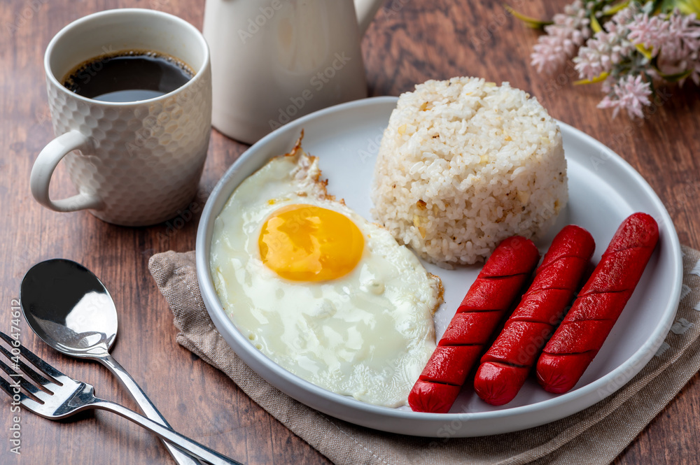 Hotsilog with cutlery) is a famous Filipino meal that
