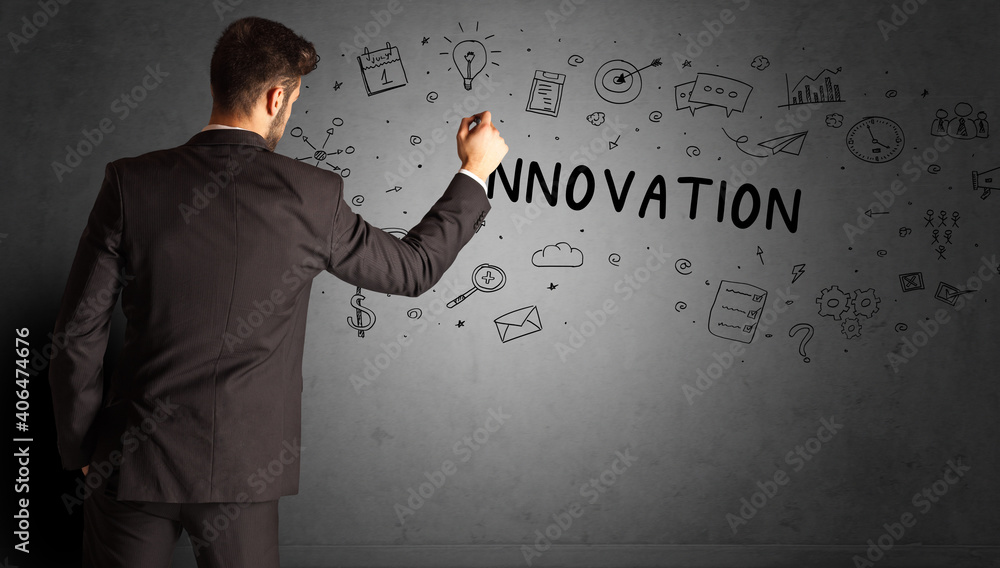 businessman drawing a creative idea sketch with INNOVATION inscription, business strategy concept businessman drawing a creative idea sketch with INNOVATION inscription, business strategy concept