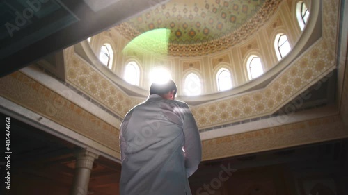 Religious muslim man praying inside the mosque
