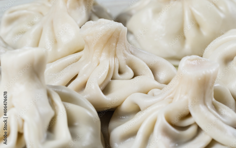 Georgian dumplings Khinkali with meat on white plate. Georgian dumplings Khinkali with meat on white plate.