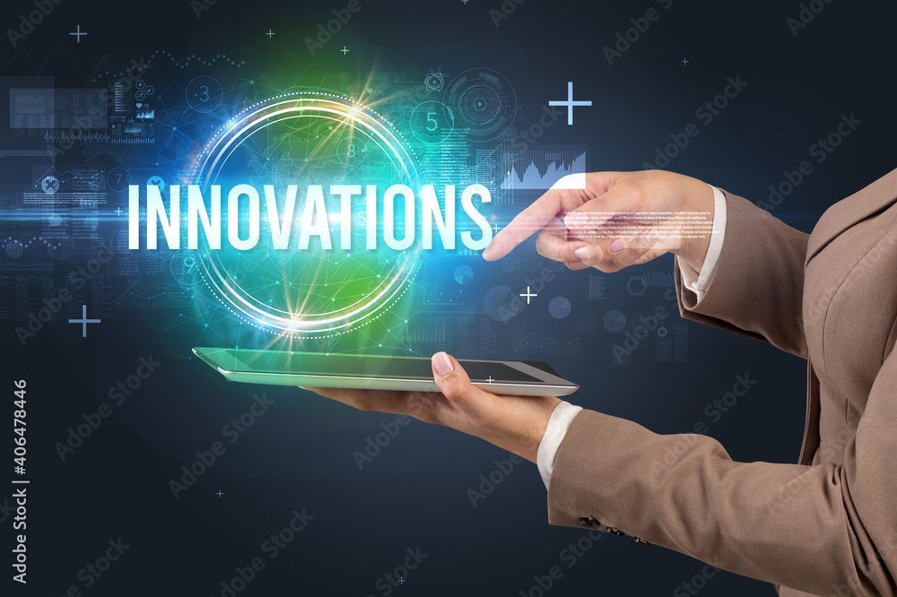 Close-up of a touchscreen with INNOVATIONS inscription, new technology concept Close-up of a touchscreen with INNOVATIONS inscription, new technology concept
