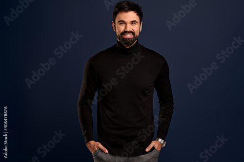 Close-up portrait of handsome successful businessman with beard, smiling happy and satisfied, express enthusiasm and positivity, staying on bright side, standing Pacific Blue background joyful