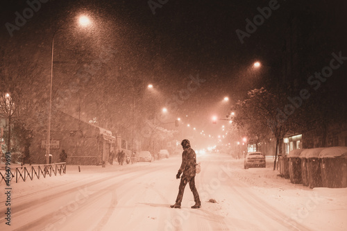 Woman in dark coat standing  during snowfall in Madrid  8th January 