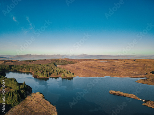Loch Lomond and the Trossachs National Park which lurks in the distant morning haze - Drone photography - Scotland