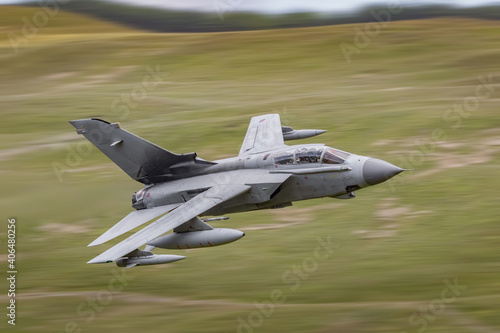 Obraz na płótnie RAF Tornado strike fighter flying low level in the mountains of the UK