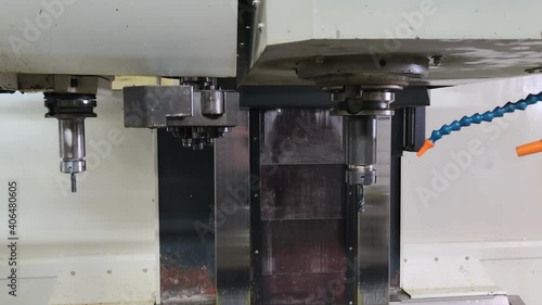 automatic tool change in modern vertical cnc milling machine photo