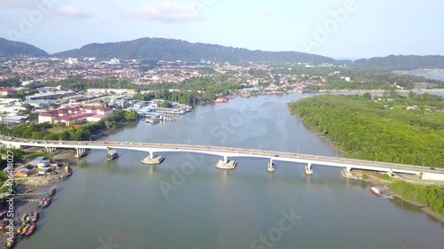 Drone view or Aerial View of Tanjung Lumpur Bridge from Kuantan River. photo