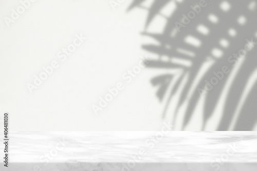 Marble Table with Palm Leaves Shadow on Wall Texture Background, Suitable for Product Presentation Backdrop, Display, and Mock up.