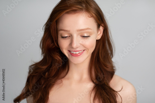 Beauty Portrait Of Red-Haired Young Lady Over Gray Studio Background