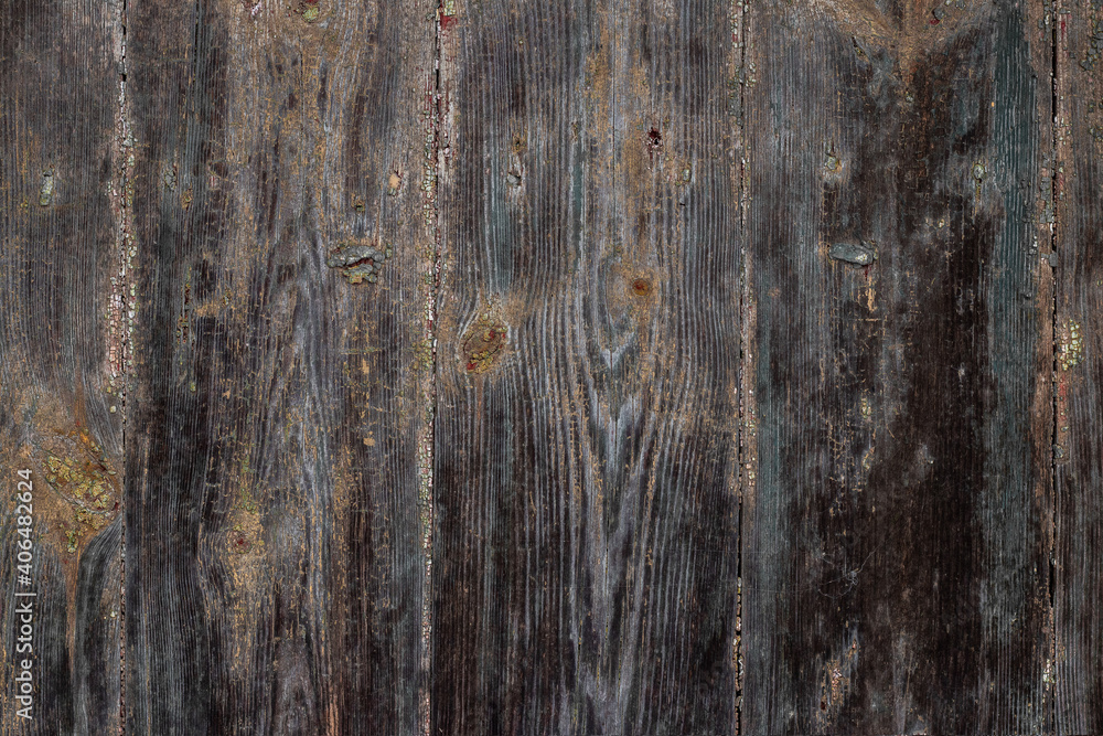 Texture of old dark wood with traces of peeling paint Texture of old dark wood with traces of peeling paint