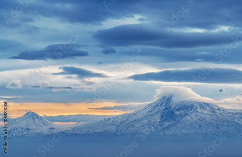 Beautiful winter landscape. Panoramic view on the lake  and mountains peaks snow-covered. Dramatic sunset.  © Inga Av