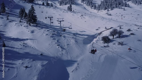 Ski Lift On The Slope Of A Big Ski Resort Of Kalavrita In Greece - aerial drone shot photo