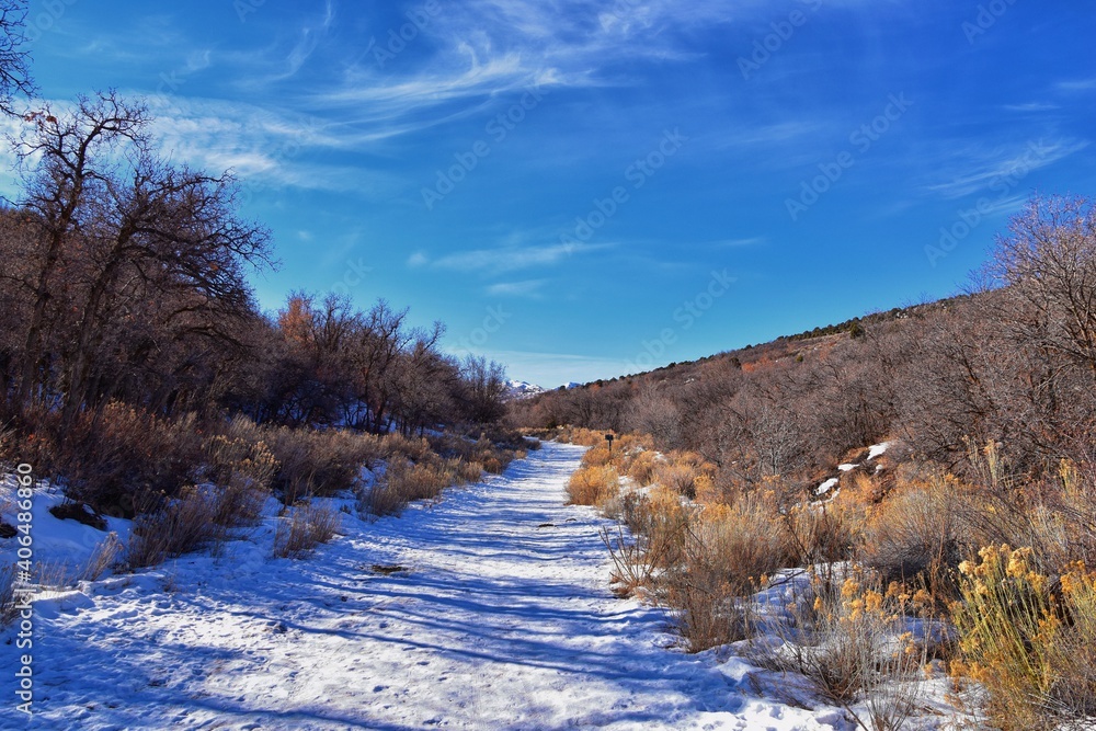 Winter snow mountain hiking trail views Yellow Fork Canyon County Park Rose Canyon by Rio Tinto Bingham Copper Mine, in winter. Salt Lake City, Utah. United States. Winter snow mountain hiking trail views Yellow Fork Canyon County Park Rose Canyon by Rio Tinto Bingham Copper Mine, in winter. Salt Lake City, Utah. United States.