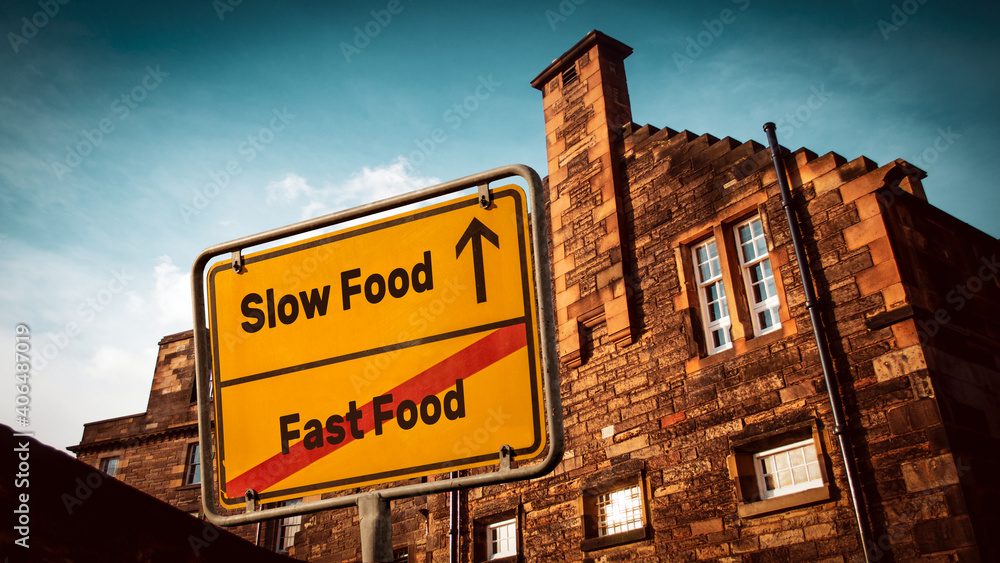 Street Sign Slow versus Fast Food Street Sign Slow versus Fast Food