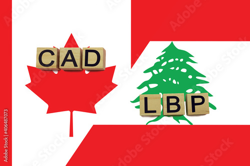 Canada and Lebanon currencies codes on national flags background photo