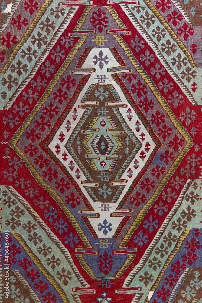 Turkish rug patterns. Turkish carpet patterns traditional middle eastern rug.Turkish prayer rug white, red patterns and motifs. in grand bazaarbazaar close up