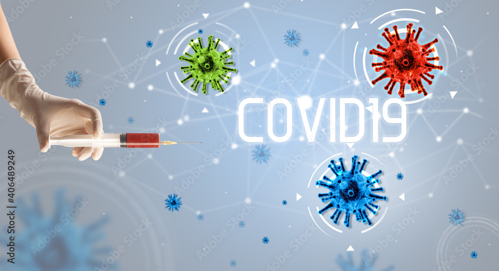 Syringe, medical injection in hand with COVID19 inscription, coronavirus vaccine concept