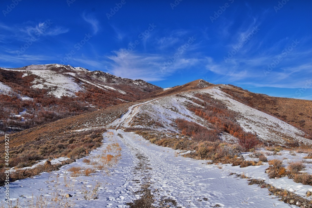 Winter snow mountain hiking trail views Yellow Fork Canyon County Park Rose Canyon by Rio Tinto Bingham Copper Mine, in winter. Salt Lake City, Utah. United States.