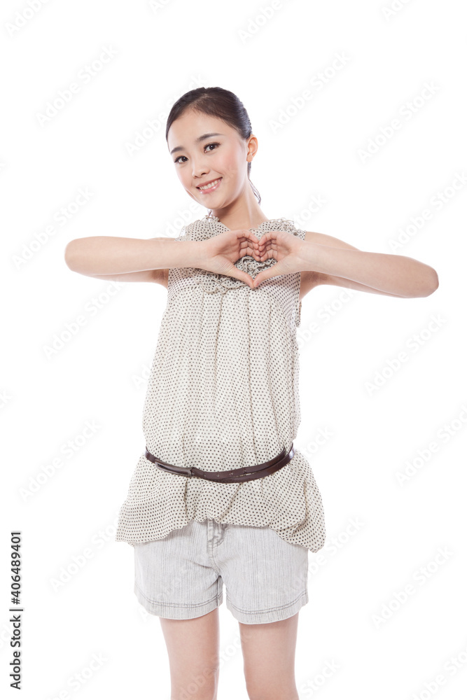Portrait of Young woman's hands forming heart Portrait of Young woman's hands forming heart