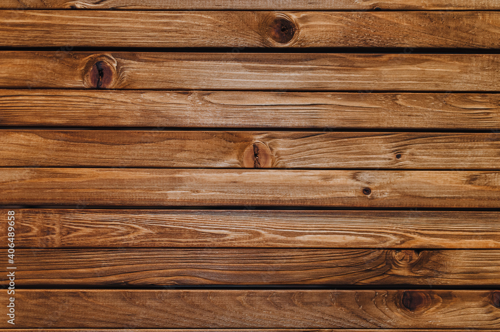 Naklejka premium Texture of brown old wood with knots. Natural boards in wood stain.