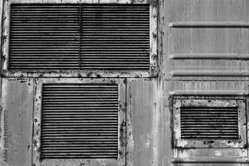 Ventilation grilles, old metal texture. The background of metal wall