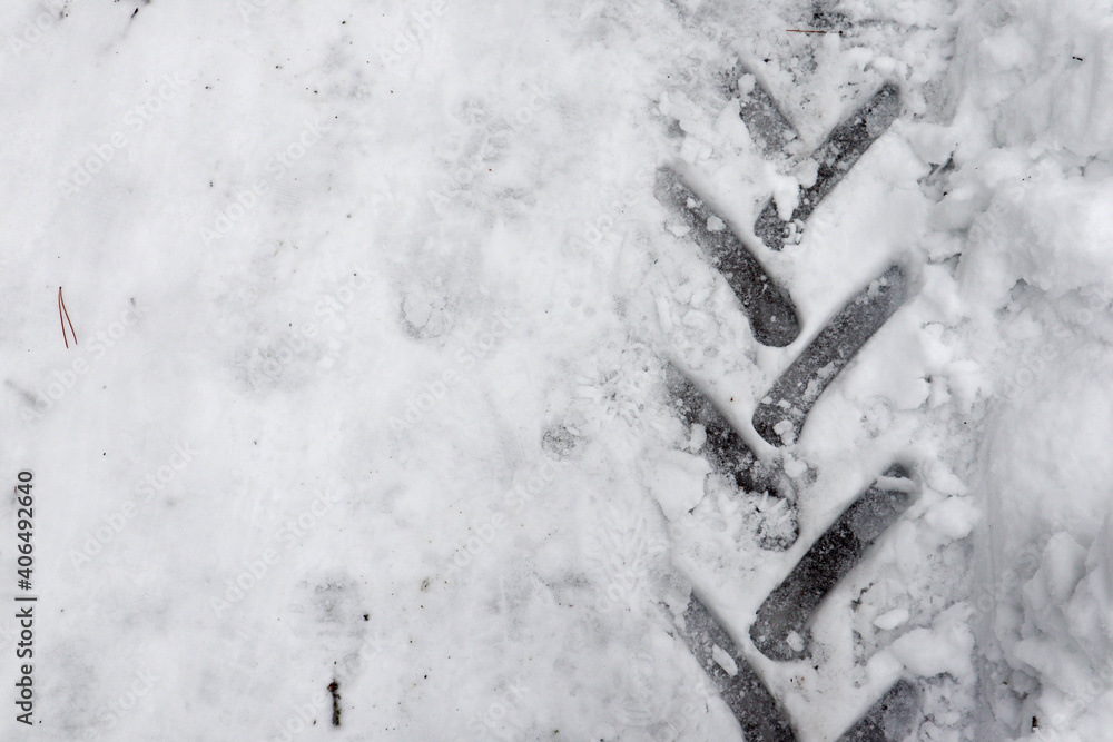 Fototapeta premium tractor tire track on snow macro