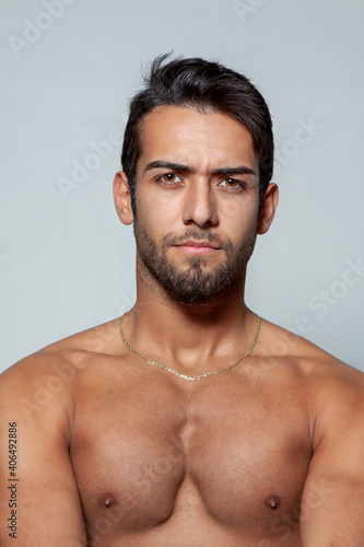 Handsome young man isolated on gray background