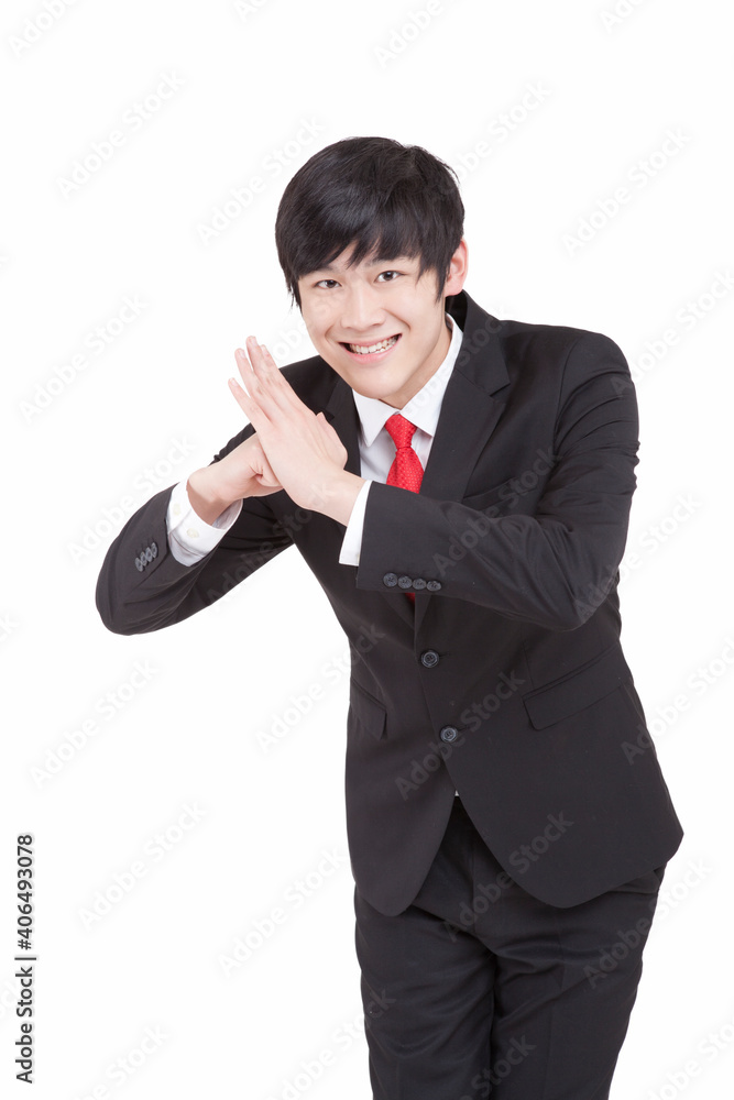Young businessman paying New Year using cell phone Young businessman paying New Year using cell phone