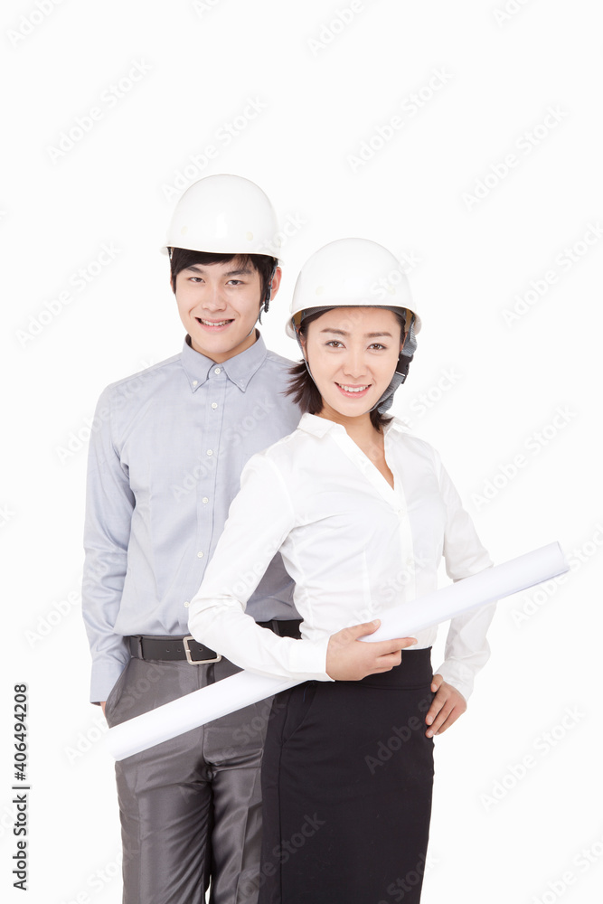 Portrait of businessman and businesswoman wearing hard hats Portrait of businessman and businesswoman wearing hard hats