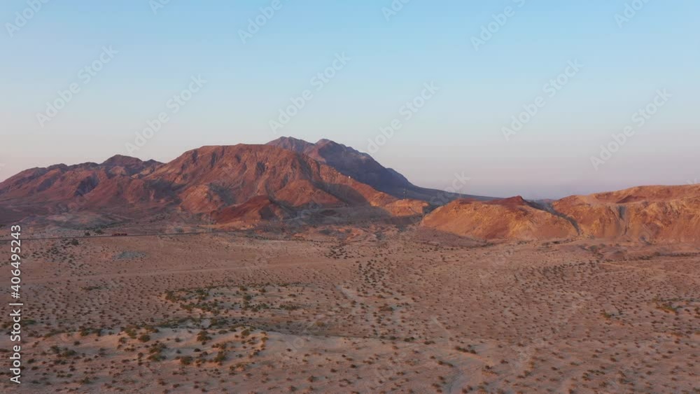 Orange desert mountain, and blue skies, from a salt lake desert at mexicali Baja California mexico. view from a drone 4k footage Orange desert mountain, and blue skies, from a salt lake desert at mexicali Baja California mexico. view from a drone 4k footage