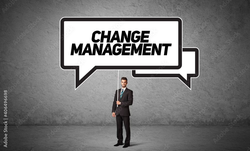 Young business person in casual holding road sign with CHANGE MANAGEMENT inscription, new business idea concept Young business person in casual holding road sign with CHANGE MANAGEMENT inscription, new business idea concept