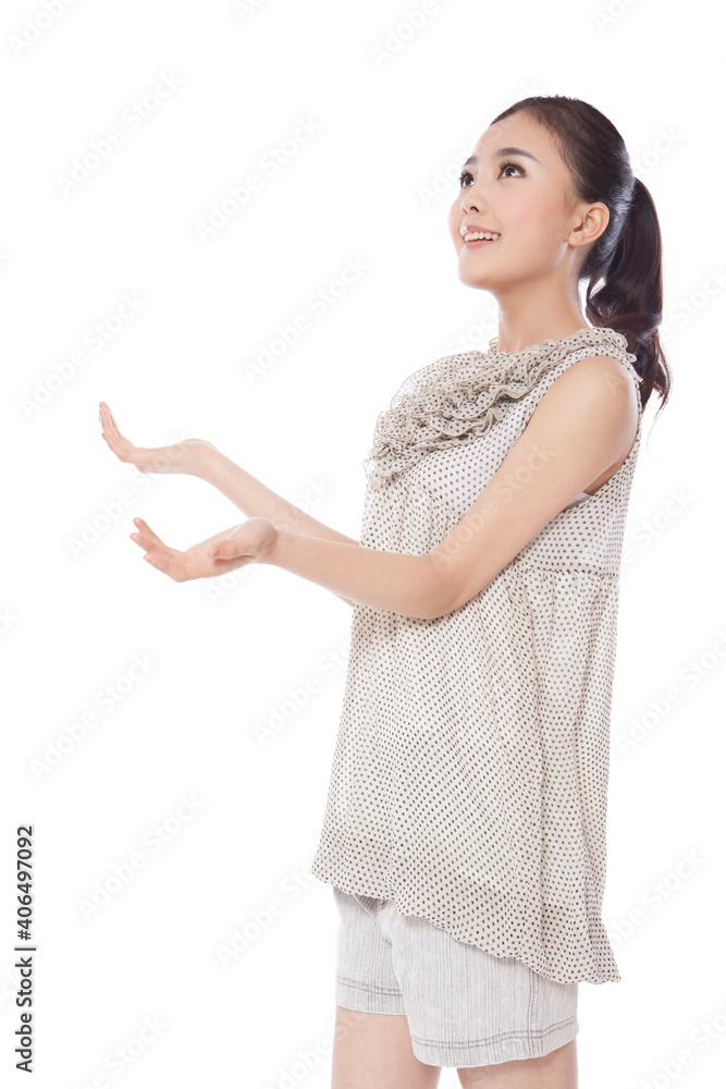 A Young woman standing with arms outstretched A Young woman standing with arms outstretched
